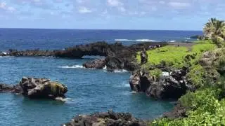 Local kids jumping off the rocks at Waianapanapa State Park