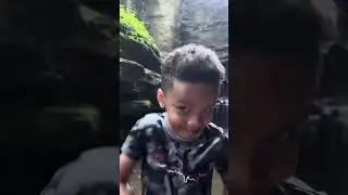 My identical twins showing us how to ground in a waterfall in nature