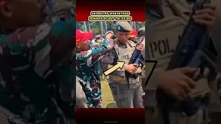 Civil Service Police Carrying Weapons During the Indonesian National Armed Forces Anniversary Par...