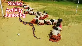 junior kg students doing snake activity