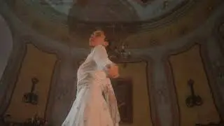 mixkit an old fashioned woman spins in a white dress 41509
