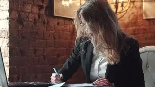 Business Woman with Glasses Working with Documents in the Office | Stock Footage - Videohive