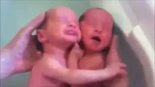 twins hugging each other after birth