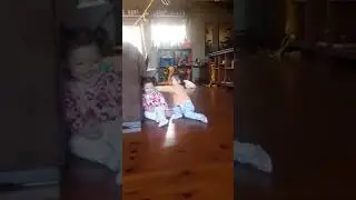 Twins playing with each other.