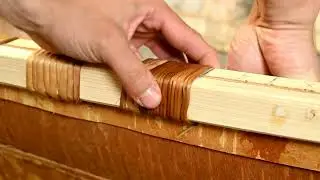 Sewing Gunwale Lashings on a Birchbark Canoe