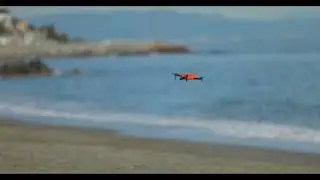 Autel Evo Nano + | quad-copter | Flying on a beach | orange with propellers | Evo Nano Plus fly
