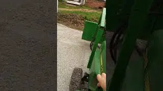 John Deere 318 Front end loader in action
