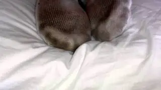 Girl foot rest on pillow - dirty socks!