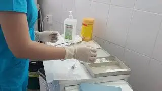 028. Learning how to administer intravenous injections. A second-year student during an internship.