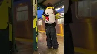 shark among backpacks 