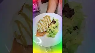 Avocado Toast with poached eggs, smoked salmon and avocado sauce on toasted bread.