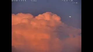 American Airlines AAL2140  flying by a huge lightning cloud