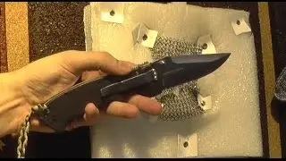 Chainmail knife resistance test. Testing knife-resistant clothing elements.