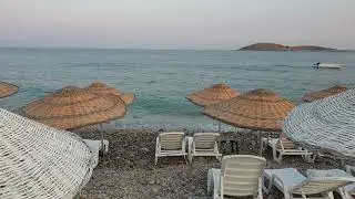 Lines Of Beach Chairs Shaded By Rattan Umbrellas On The Shore Of A Brach 🌊🌊🌊#shorts #viralvideo