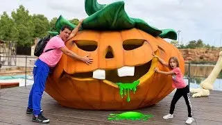 Sofia and daddy have fun playing at the amusement Park