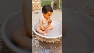 Cute little girl in the 💧 water... Vihu taking shower in her way