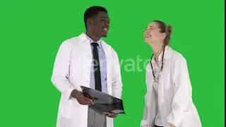 Laughing doctors studying X-ray on a Green Screen, Chroma Key. | Stock Footage - Videohive