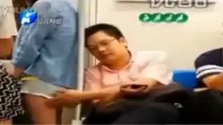 Chinese politician gropes woman on train VIDEO
