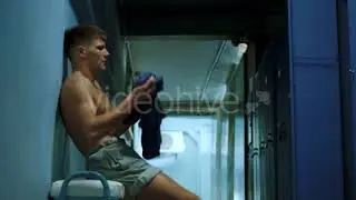 Sportsman Undressing in Locker Room | Stock Footage - Videohive