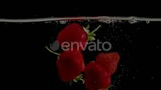 Strawberry Slow Motion Closeup Falling in Water | Stock Footage - Envato elements