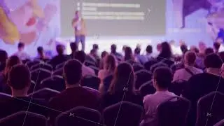 Audience attending a speaker presentation at a conference event