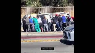 Policewoman makes bystanders pick up crashed van for her in South Africa!