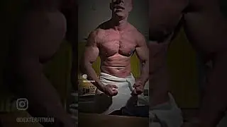 Fit dude flexing after shower