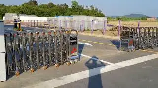 Automatic stainless steel accordion barrier