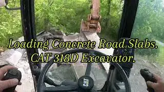 CAT 318D Loading Concrete Road Slabs Into Tri Axle. #excavator #construction #concrete