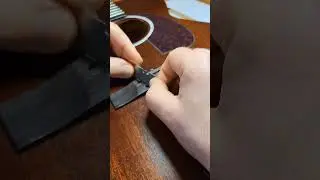 Repairing a bridge on a Guild acoustic. 