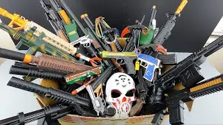 Military Weapons Box of Toy Guns. Military Arsenal, Interesting Mask & Rifle Equipments