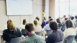 Audience listening to speaker at a business conference presentation