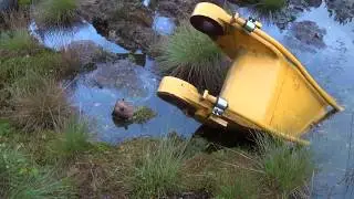 EXCAVATOR SUNK IN A SWAMP
