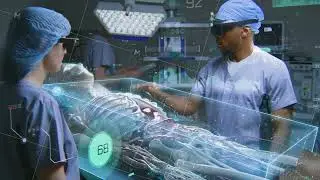 African American surgeon and nurse in AR headsets work in surgery room