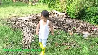 Toddler Playing Outside After the Rain