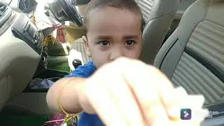 Cute 3 years old baby boy eating potato chips
