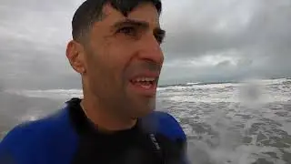 Boogie Boarding Satellite Beach during storm with overhead waves