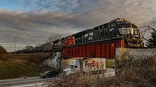 NS 3677 leads CN U705 with CN SD70ACe 8102 trailing through Glendale Heights, IL on 12/6/2024.