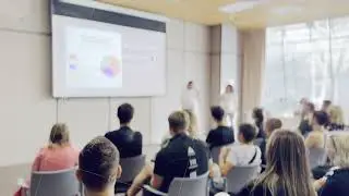 Blurred audience at a business presentation in a modern conference room