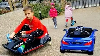 Mister Max has a new cool car! Miss Katy and Alice are walking in the courtyard of Katy and Max