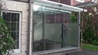 Безрамное раздвижное остекление веранды