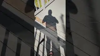 shadow of a man waving