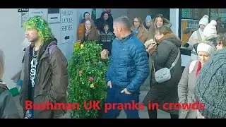 Pranking in crowds of people. Christmas fun. Bushman prank.