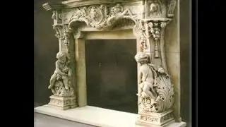 Резной камин из мрамора.