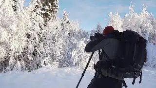 Landskap med nysnö och ån vid Västanåfallet
