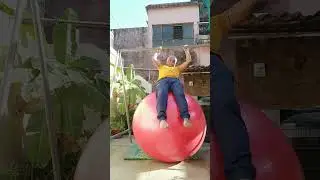 BALANCING YOGA ON A GIANT BALL