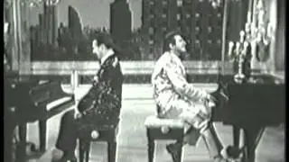 Liberace performing Night and Day and There'll Be No New Tunes On This Old Piano