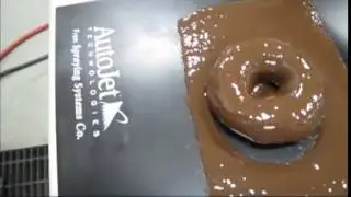 Spraying Chocolate on Doughnuts with AccuCoat® Heated Spray System