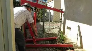 Using an engine hoist to pull out large shrub.