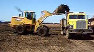 624H loading manure spreader